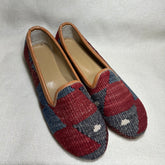 Harlequin in dark blues and red